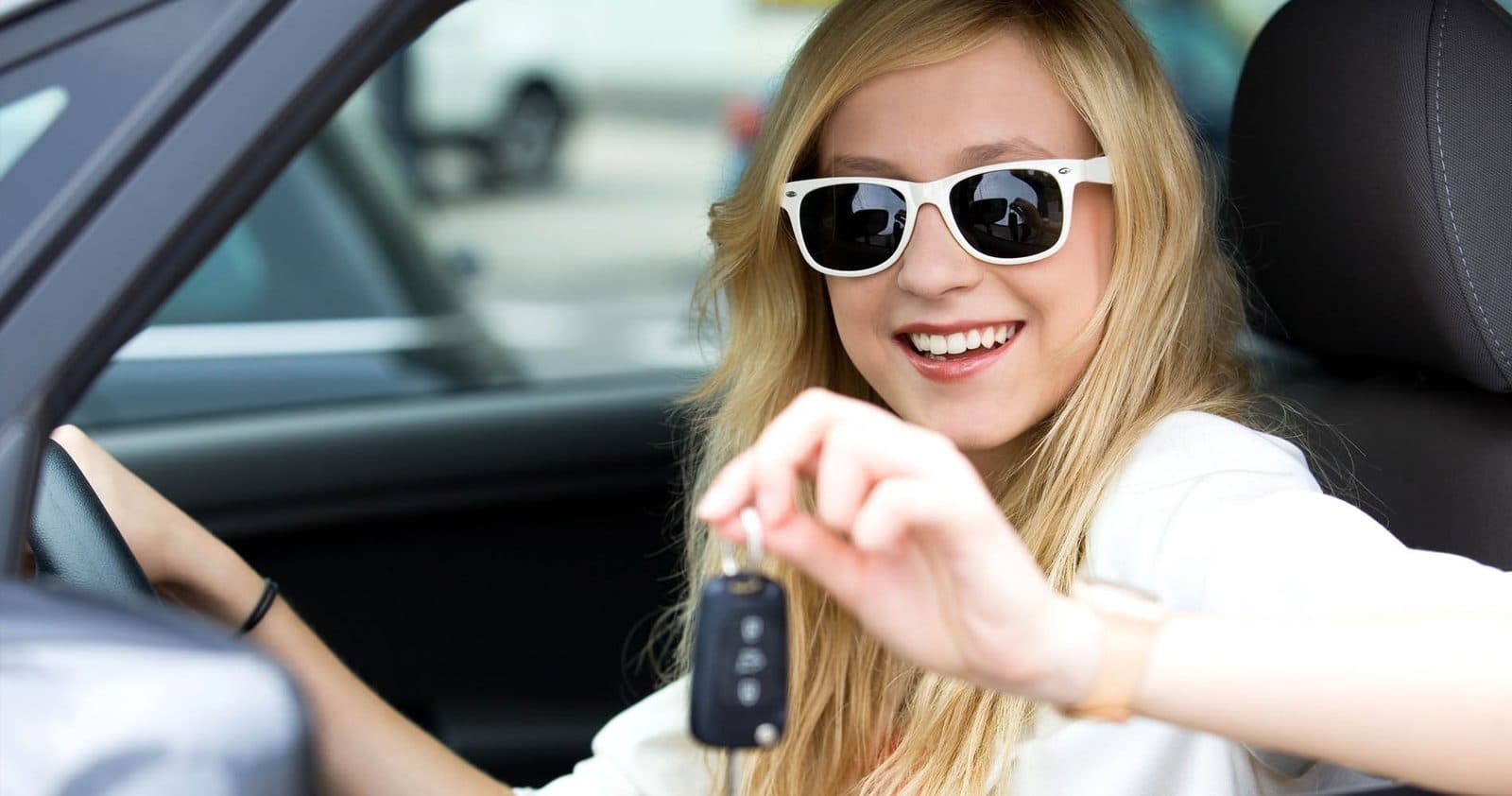 A young driver holding car keys